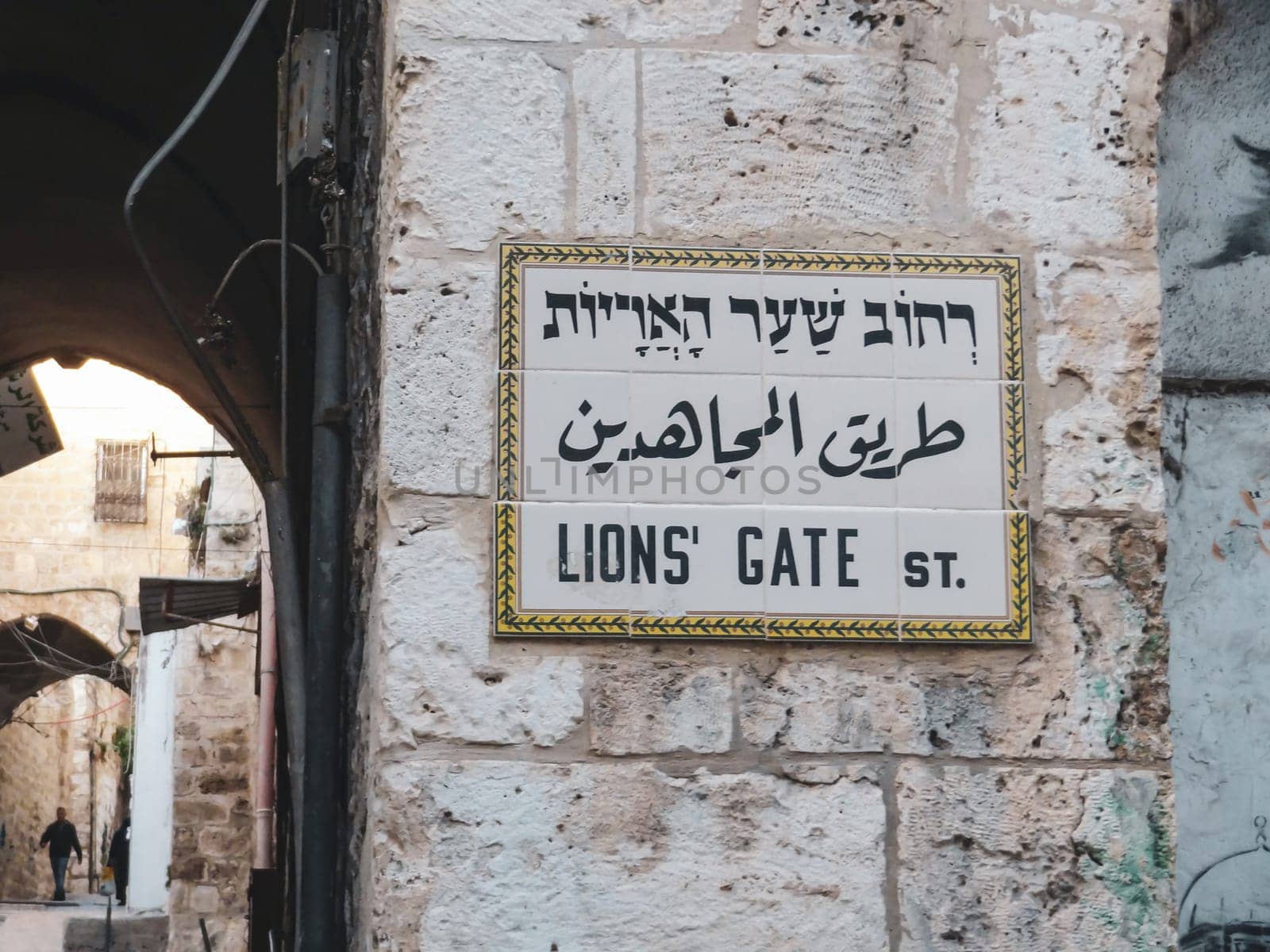 Sign with the name of the street Via Dolorosa in Jerusalem in hebrew, arabic and english. Jerusalem, Israel - November 15, 2023