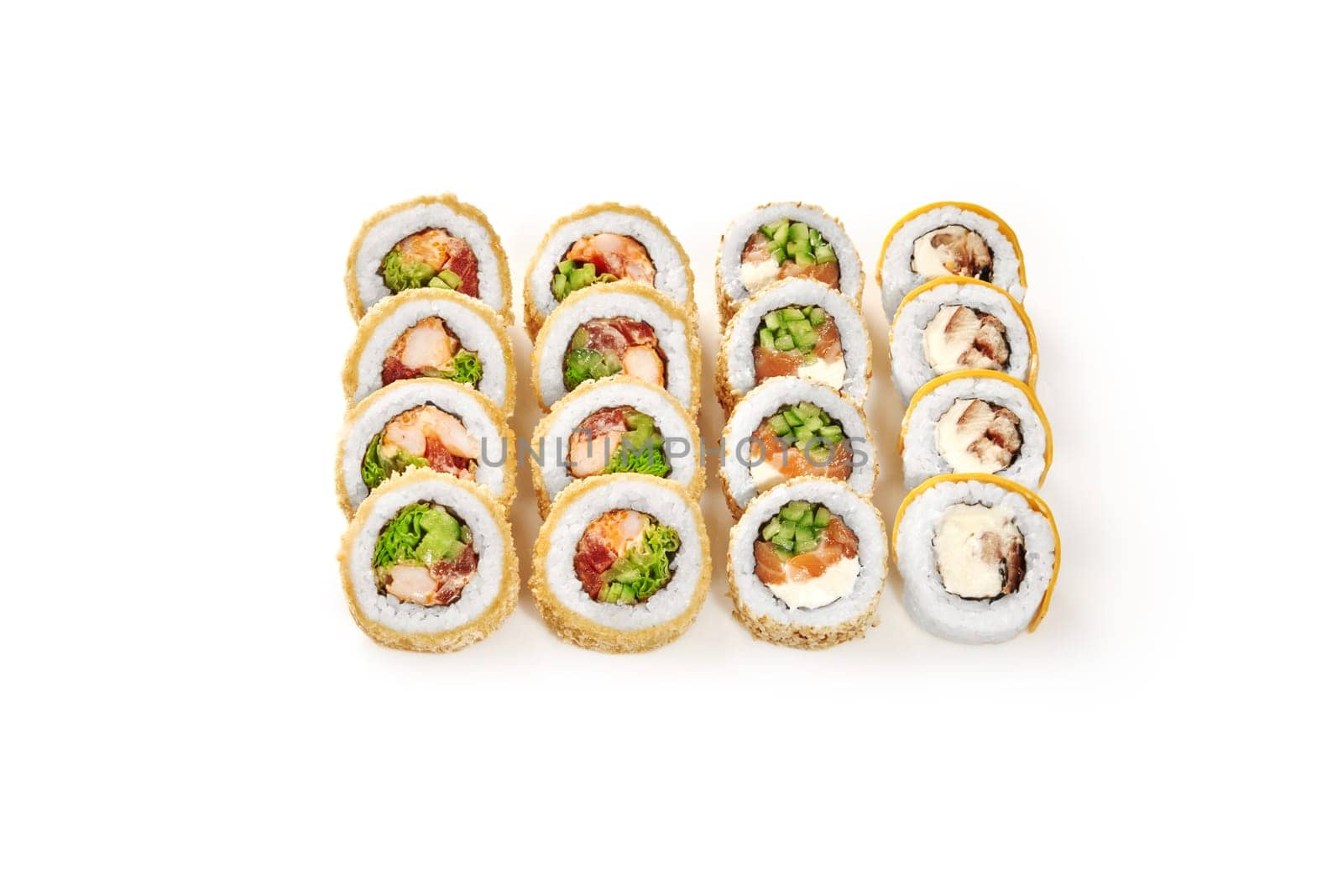 Crispy tempura with crab and tobiko, sesame covered salmon rolls and unagi uramaki topped with sweet mango neatly arranged isolated on white background. Japanese culinary traditions