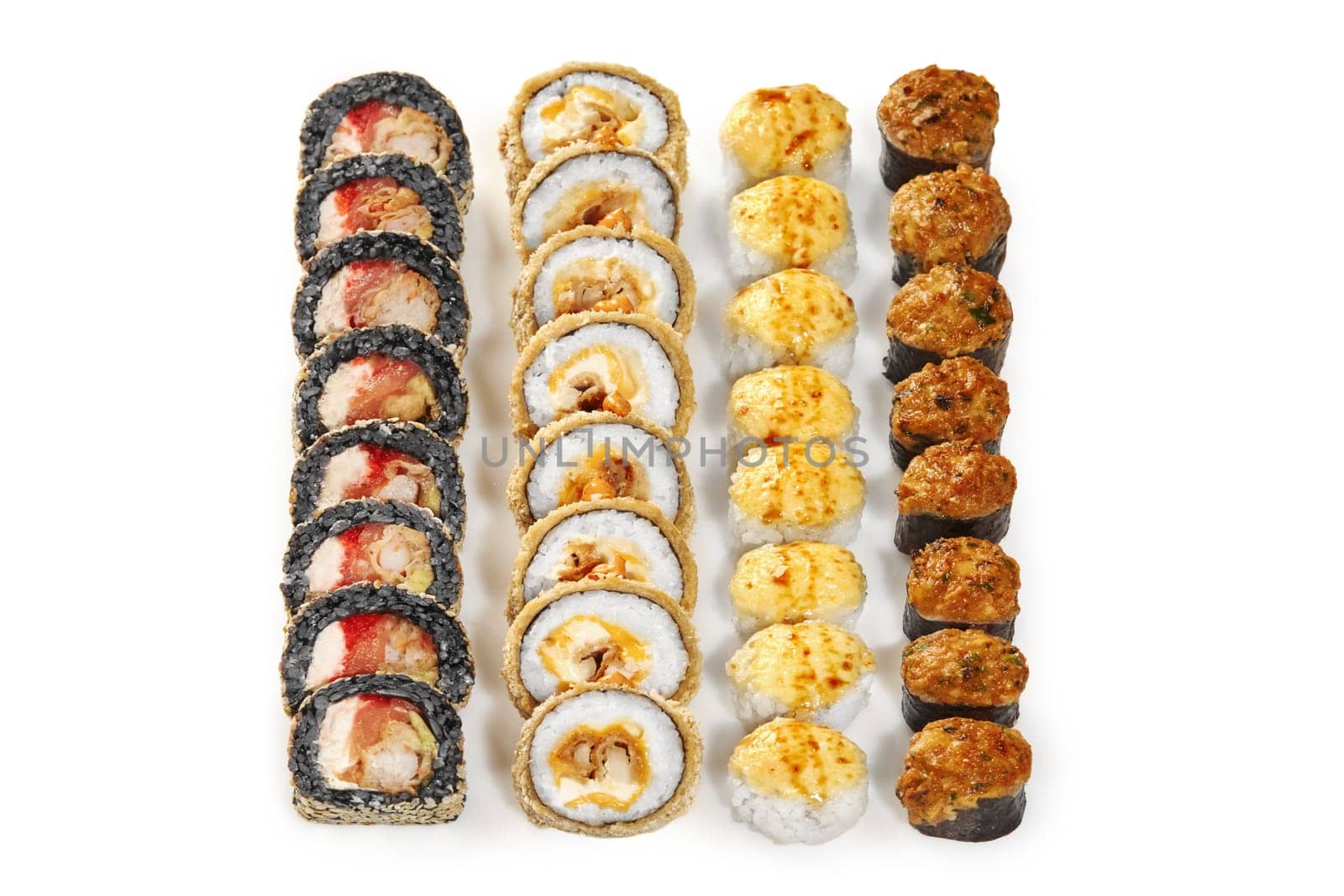 Baked rolls with golden cheese caps, black rice uramaki with shrimp and crispy tempura rolls with fried chicken displayed isolated on white background. Japanese style snacks