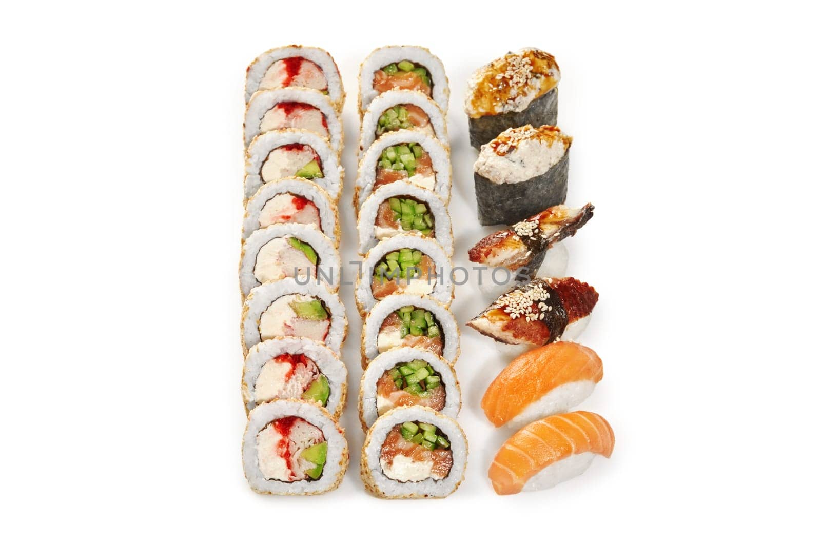 Delicious sushi set for two of classic sesame coated uramaki rolls, nigirizushi and gunkan maki with salmon and eel drizzled with unagi sauce, isolated on white Japanese cuisine