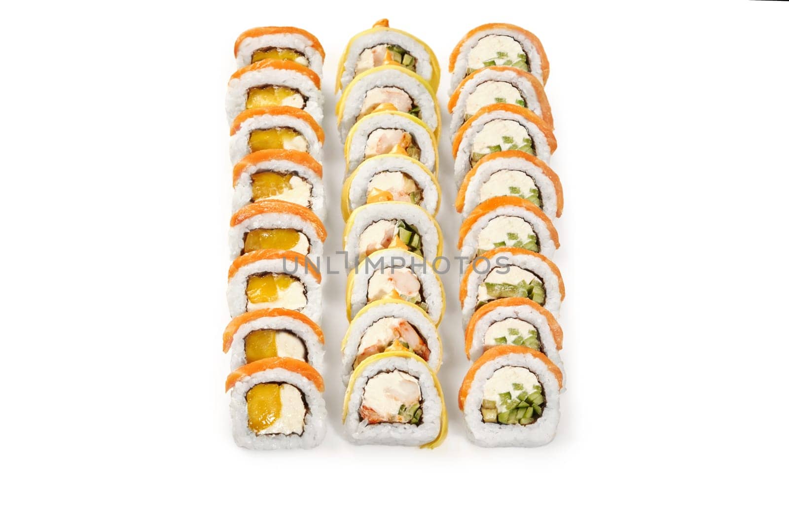 Set of delicious uramaki rolls with salmon, crab, cheese and mango arranged on white background. Japanese fusion cuisine. Sushi bar menu concept