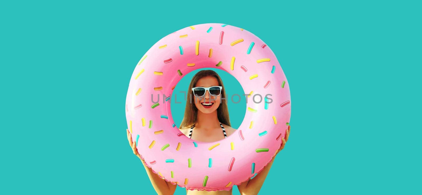 Summer vacation, tourism, happy cheerful young woman with swimming inflatable ring on blue by Rohappy