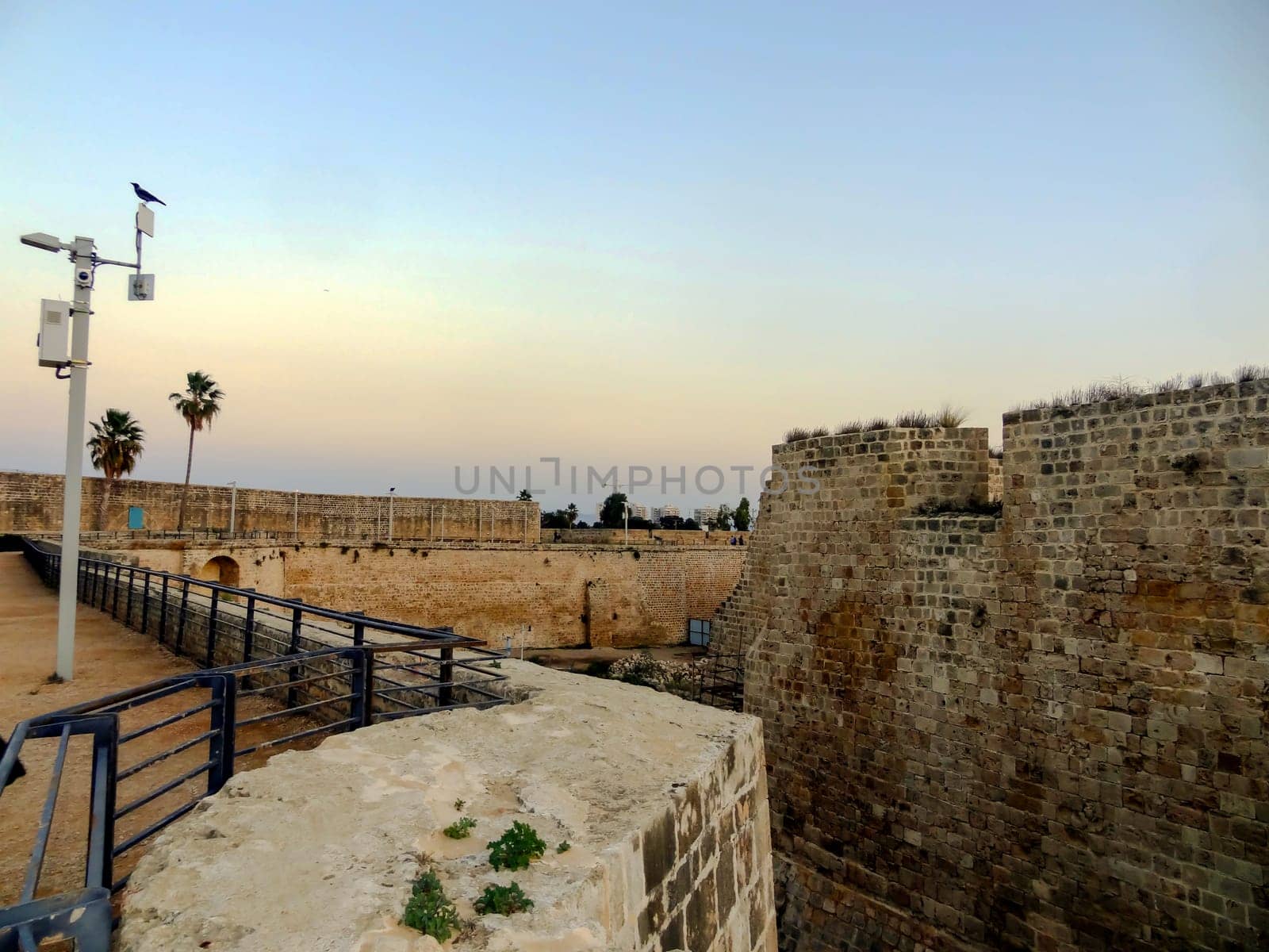 Evening view of the wall fortress of the old city of Akko in Israel. High quality photo