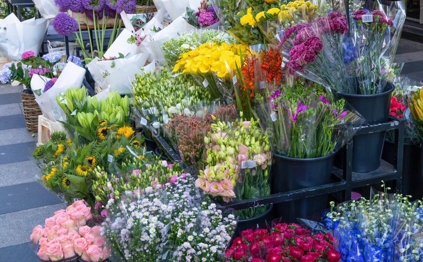 Bouquets of various flowers are sold in a flower shop. High quality photo