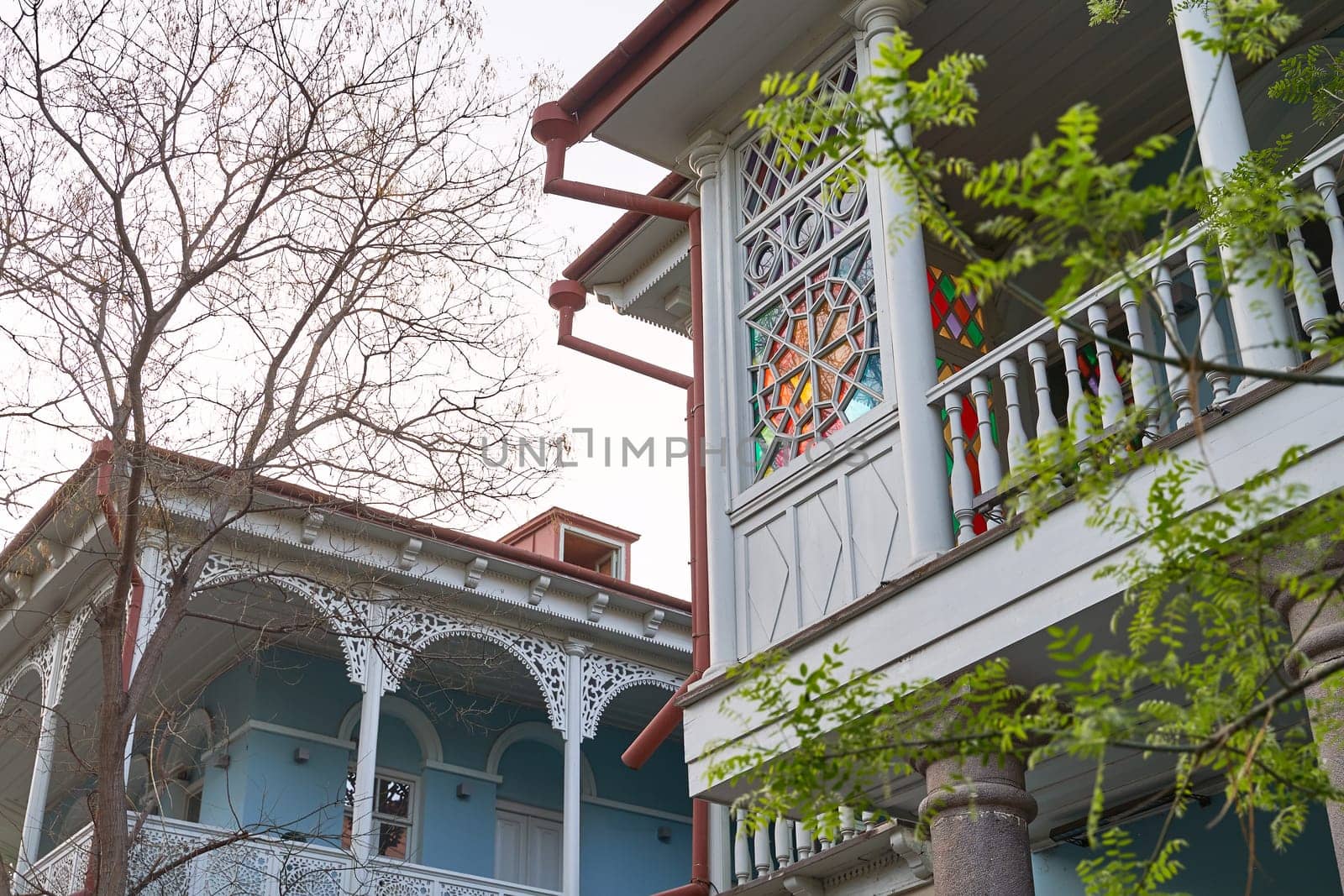Architecture details in Tbilisi, Georgia with a stained glass window