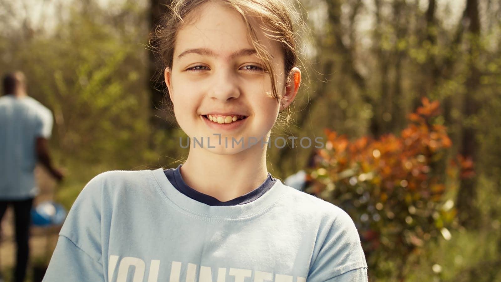 Small child holding soil with a green sprout in her hands by DCStudio