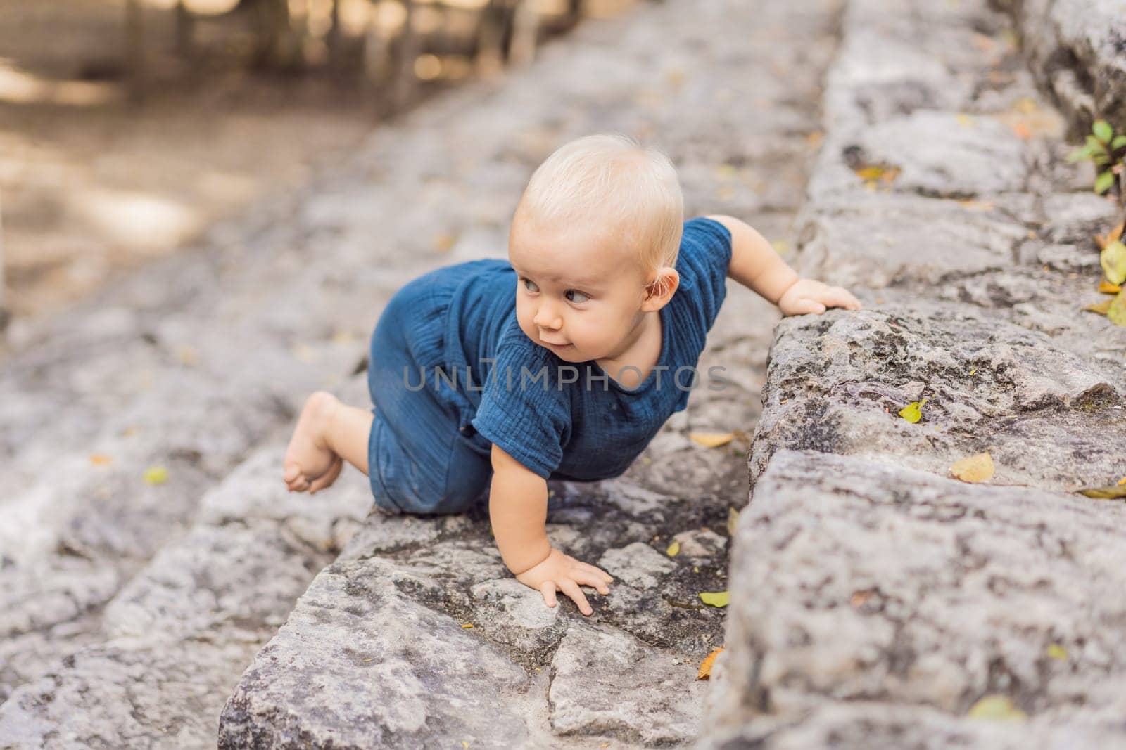 Baby tourist at Coba, Mexico. Ancient mayan city in Mexico. Coba is an archaeological area and a famous landmark of Yucatan Peninsula. Cloudy sky over a pyramid in Mexico by galitskaya