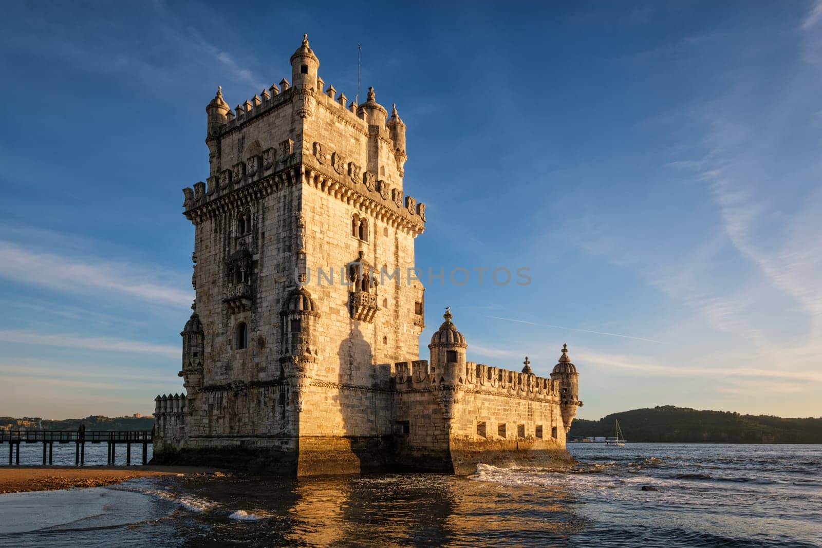 Belem Tower on the bank of the Tagus River on sunset. Lisbon, Portugal by dimol