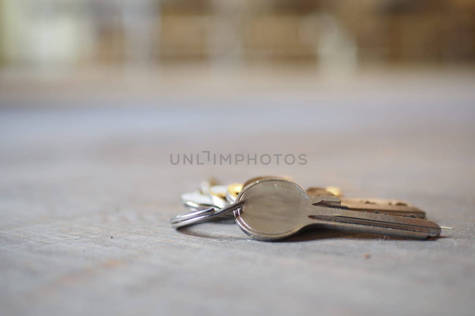 house keys on the ring on table in a room. Bunch of apartment keys. To forget keys at home concept ,