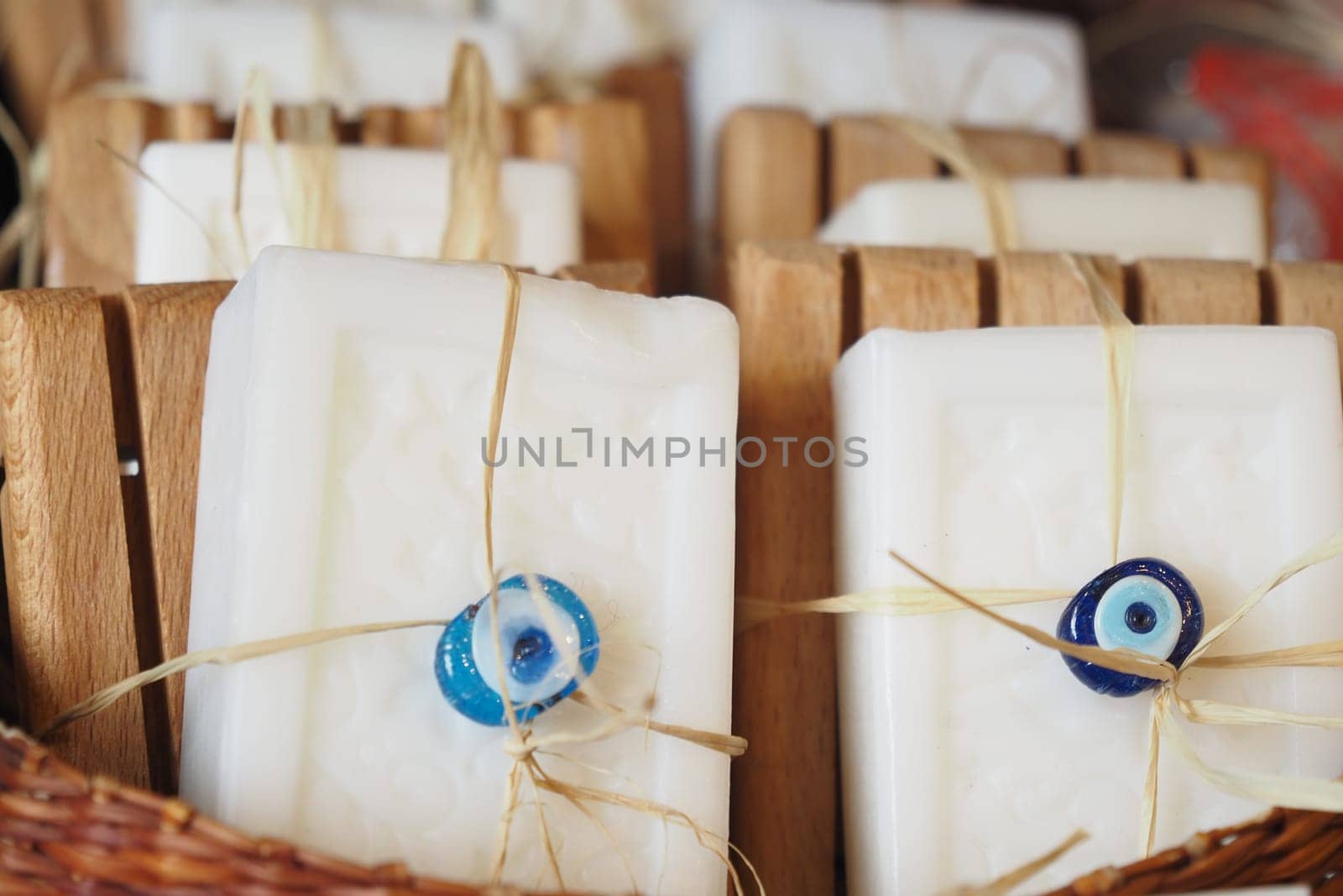 Stack of soap topped with evil eye beads