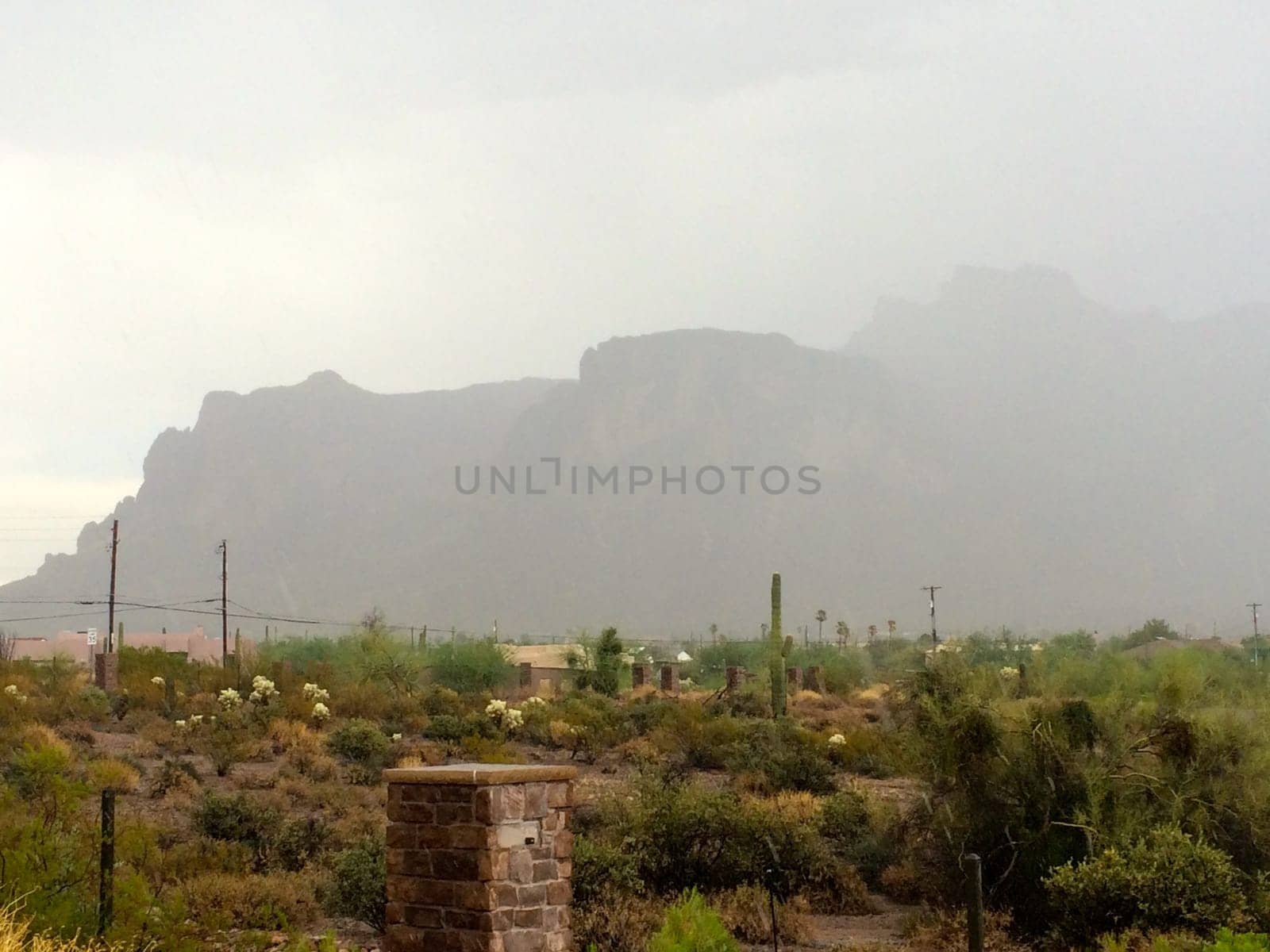 Summer Storm Over the Superstition Mountains in Arizona by grumblytumbleweed