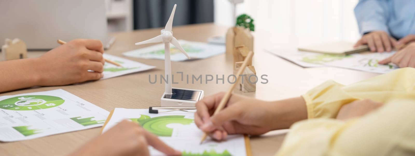 Green business meeting represented renewable energy. Closeup. Delineation. by biancoblue