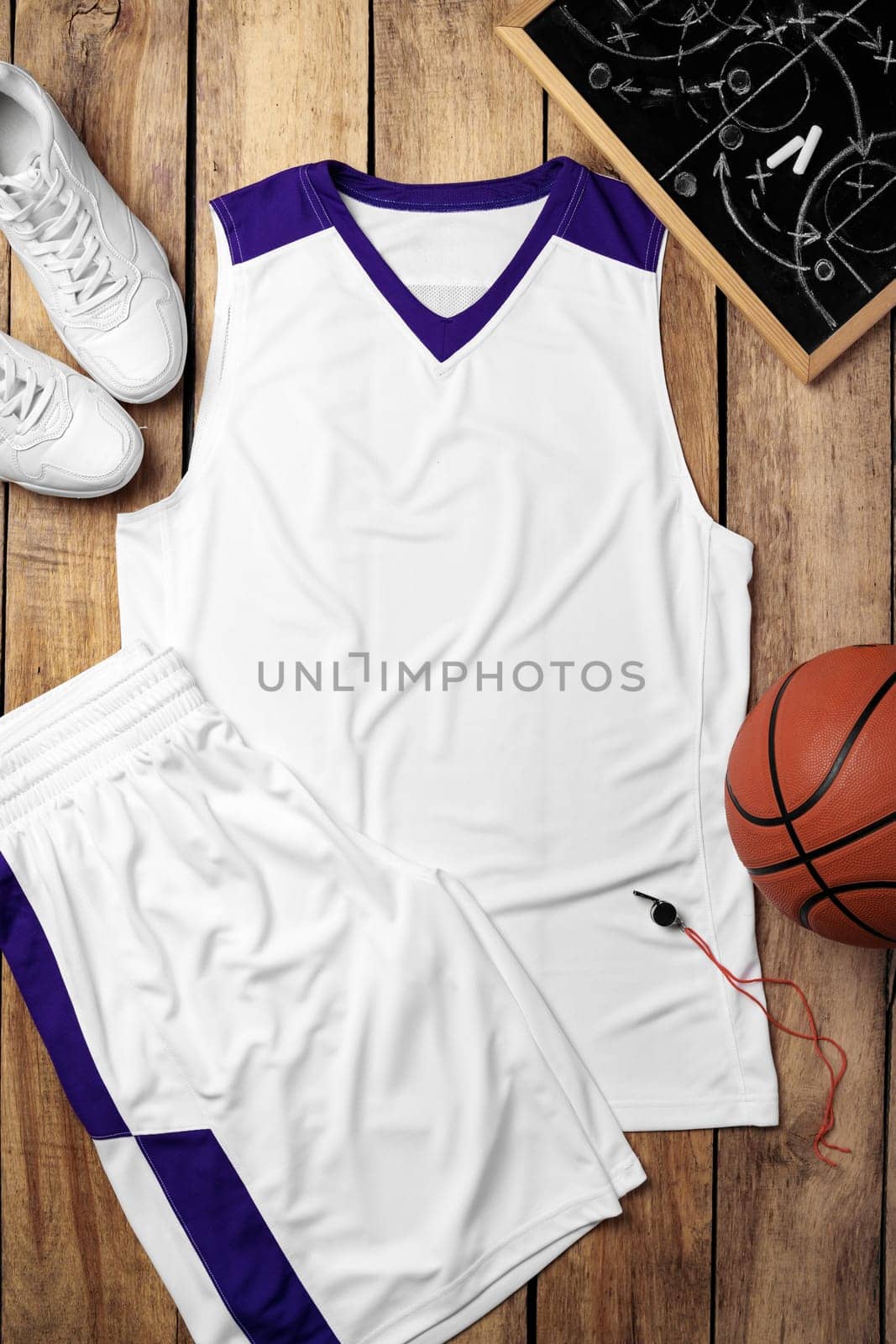 Basketball uniform on wooden background top view by Fabrikasimf