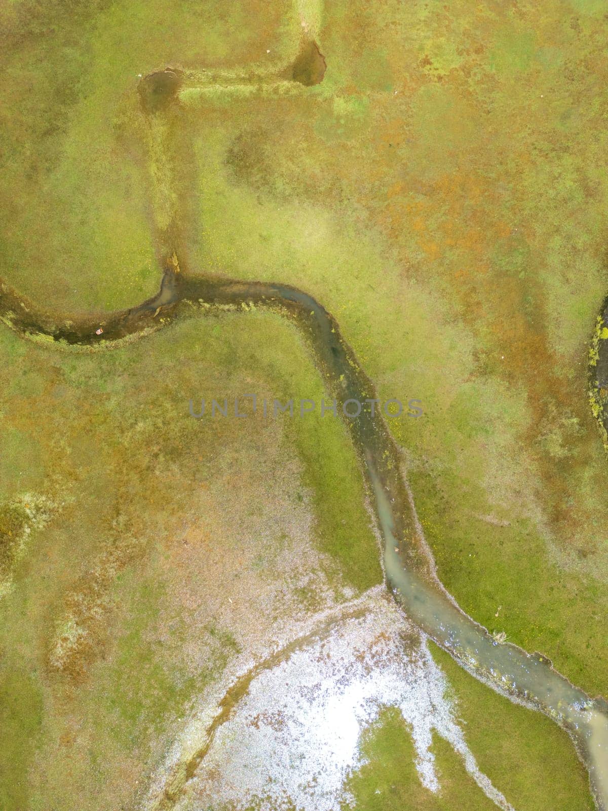 The meander in Antalya Sobucimen plateau. Aerial view of complex waterways weaving  through lush green fields