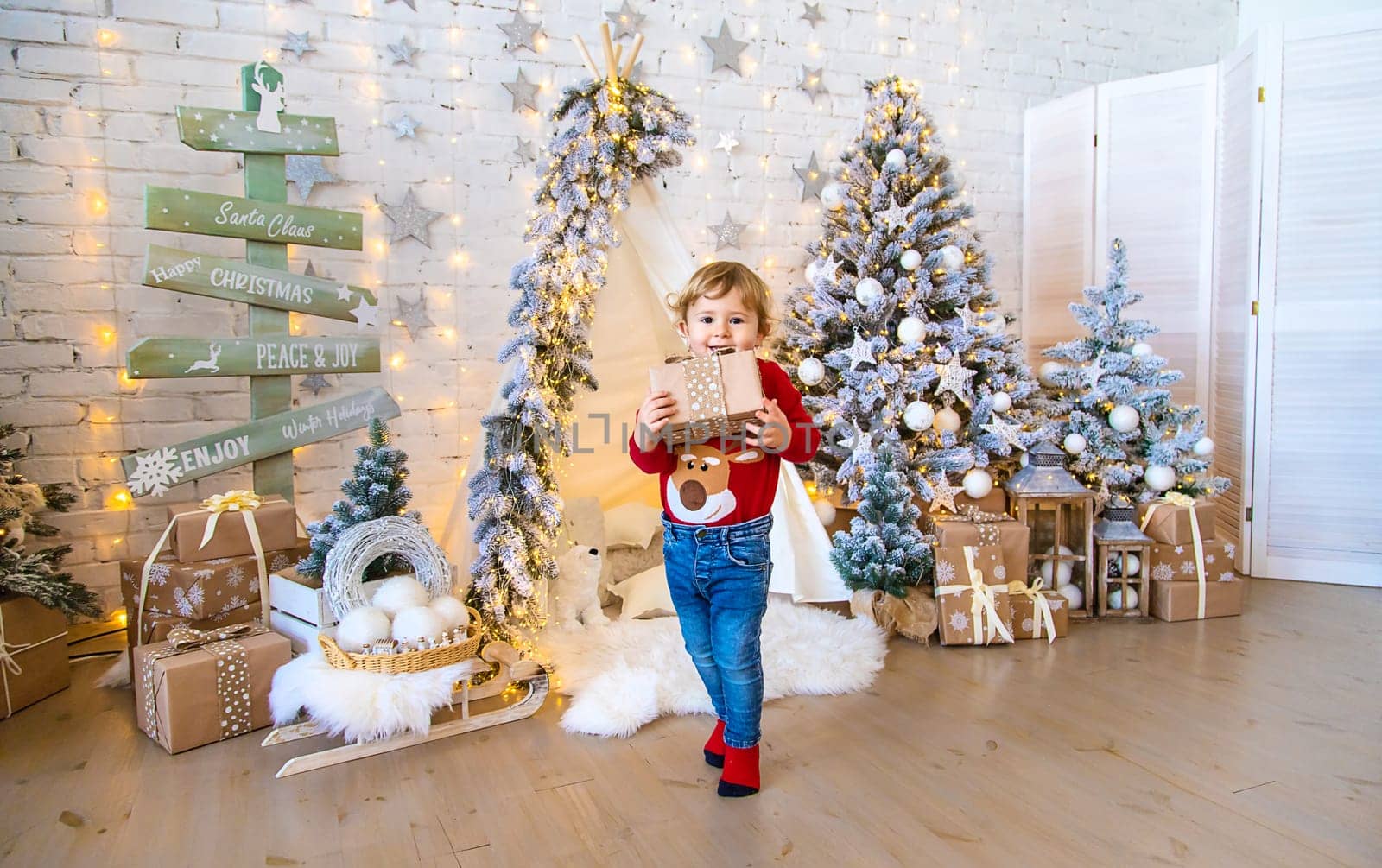 Child in his room decor christmas. Selective focus. Kid.