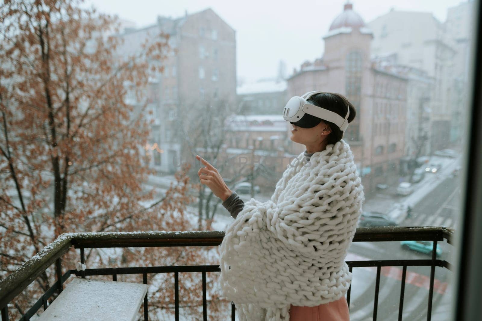 A captivating girl explores the virtual world against the backdrop of the winter city. by teksomolika