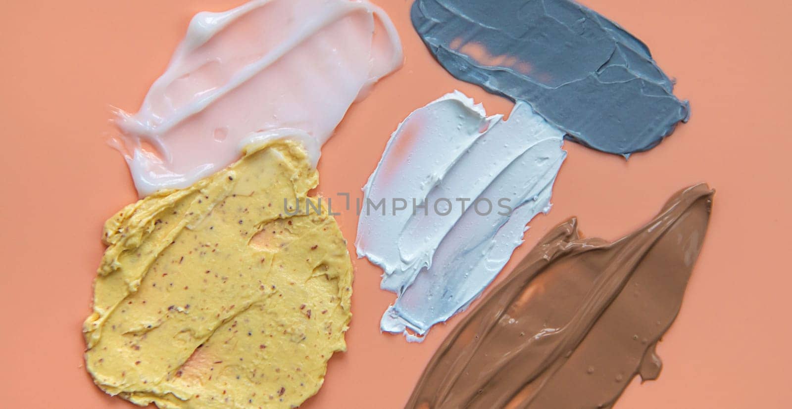 Different smears of cosmetics. Selective focus. Wet cream.