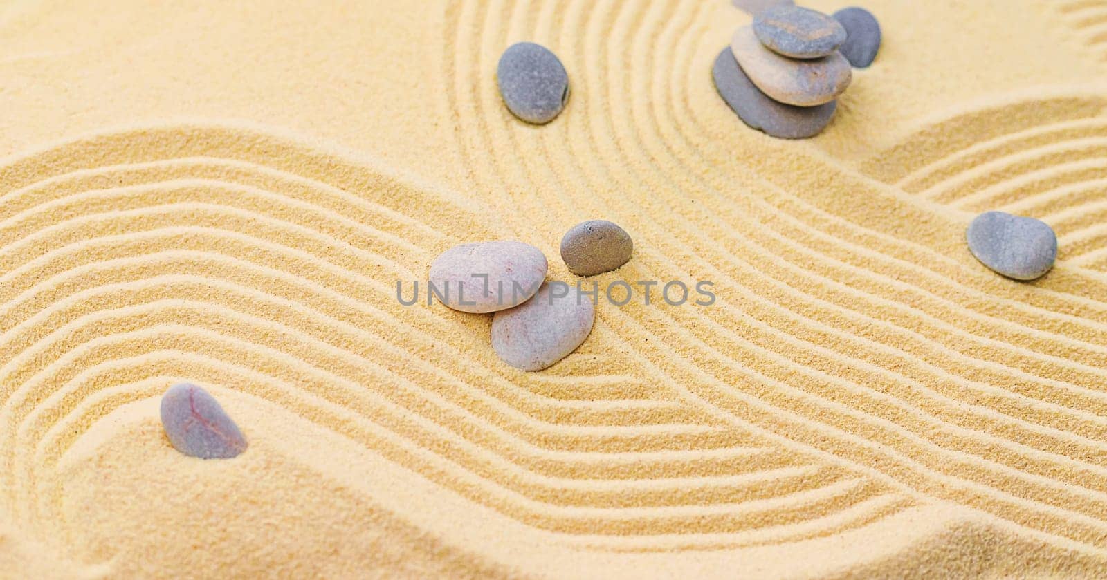 Background with stones on the sand. Selective focus. Spa.