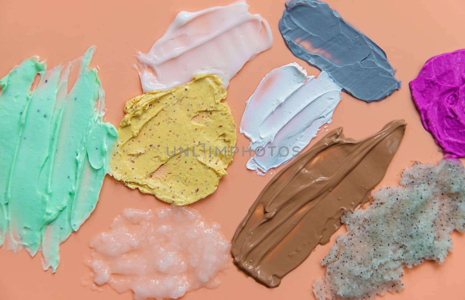 Different smears of cosmetics. Selective focus. Wet cream.