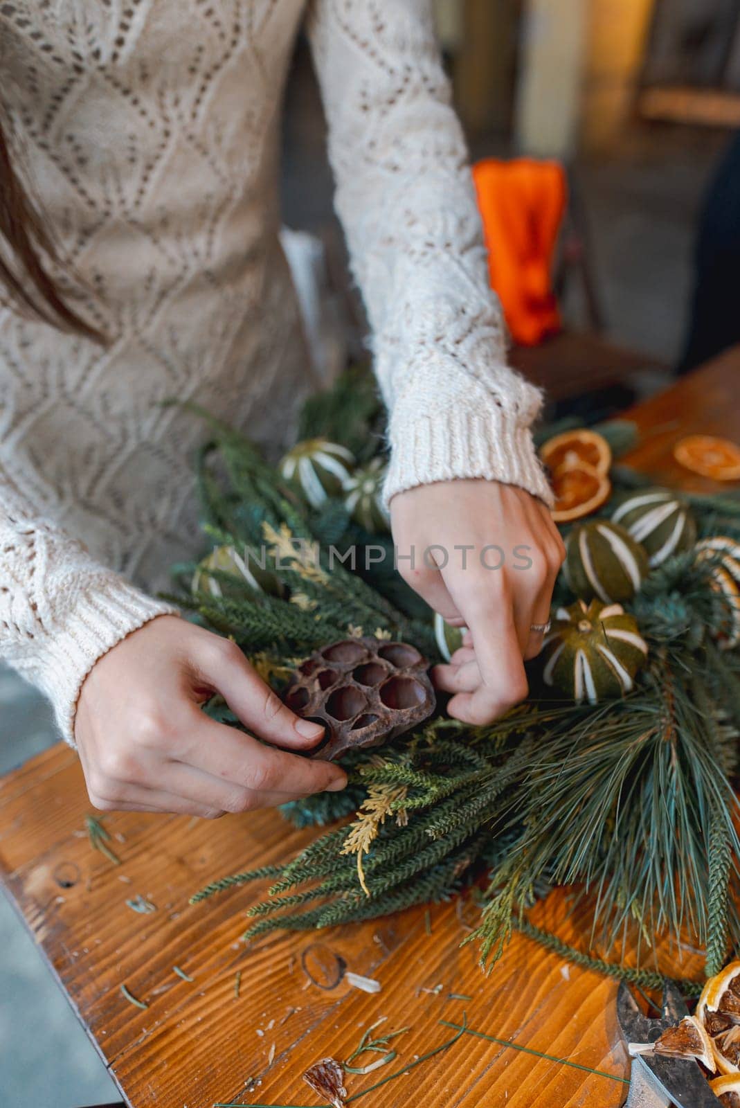 Crafting session teaching how to make Christmas wreaths and New Year's decor. High quality photo