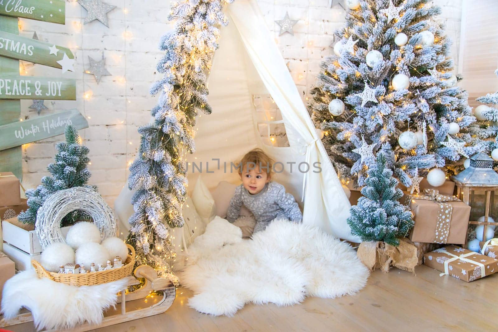 Child in his room decor christmas. Selective focus. Kid.