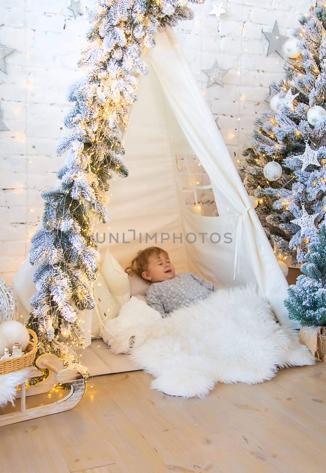 Child in his room decor christmas. Selective focus. Kid.