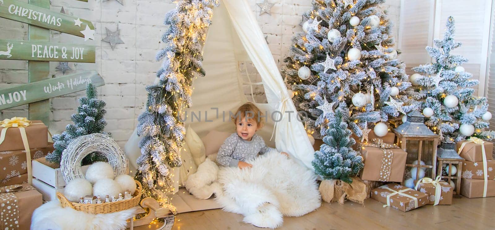 Child in his room decor christmas. Selective focus. Kid.