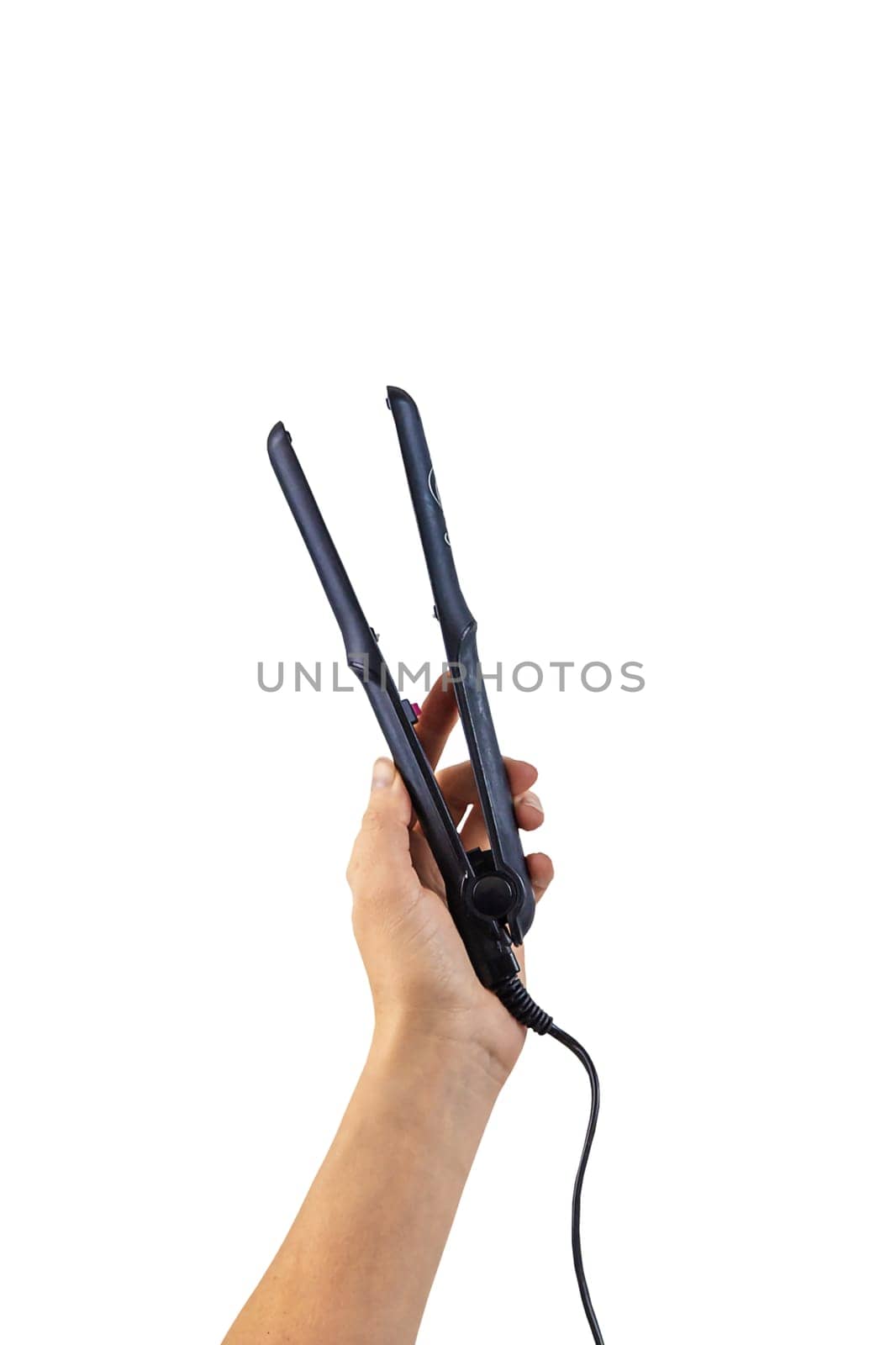 Curling iron in woman hands isolate. Selective focus. by yanadjana