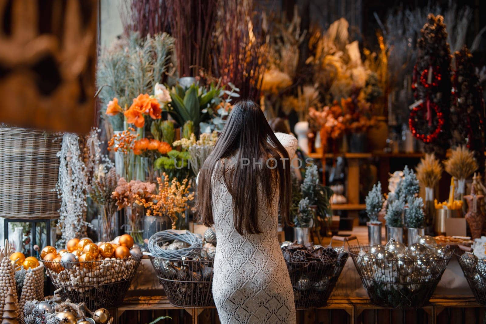 Festive and inviting Christmas decor displayed at the store counter. by teksomolika