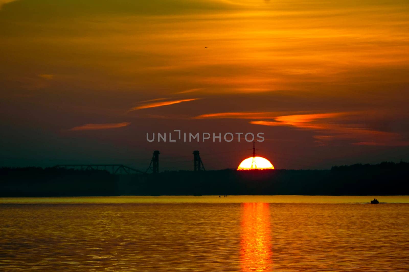 Golden sunset on the beach at neva river in saint-petersburg, russia. Tranquil scene. Nature background. Landscape. High quality photo