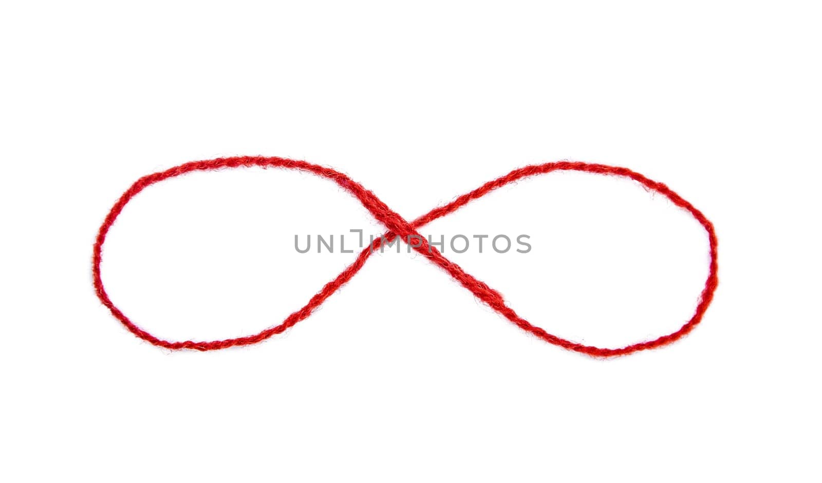 Red thread isolate on white background. Selective focus. by yanadjana