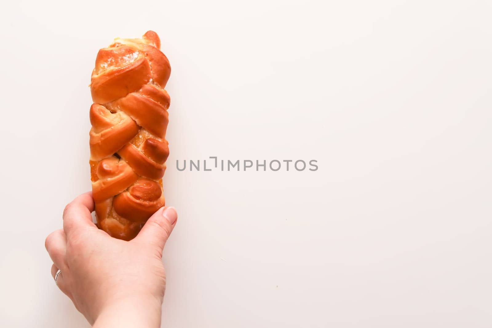 Freshly baked sweet buns. Homemade pastry on white background.