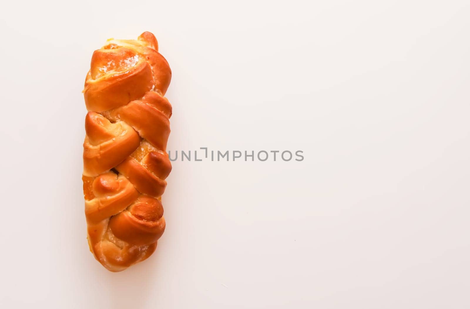 Freshly baked sweet buns. Homemade pastry on white background.