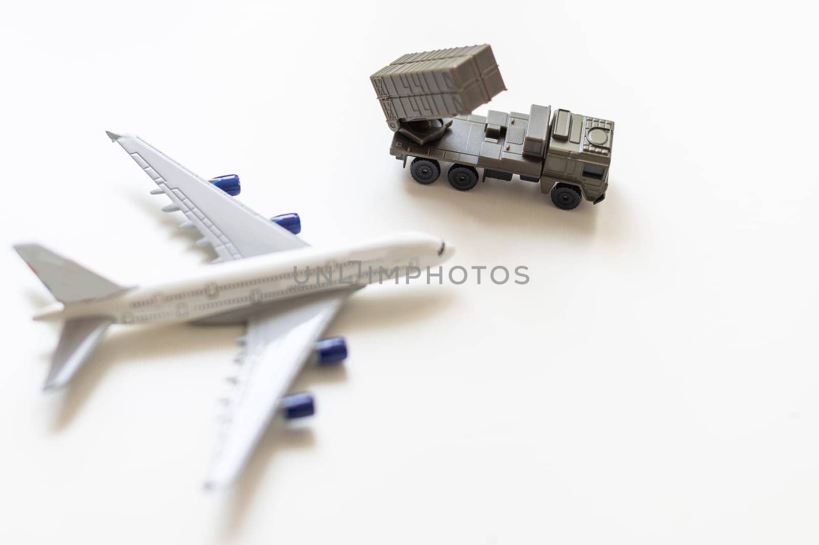 Top view on plastic model military vehicle and aircraft by Andelov13