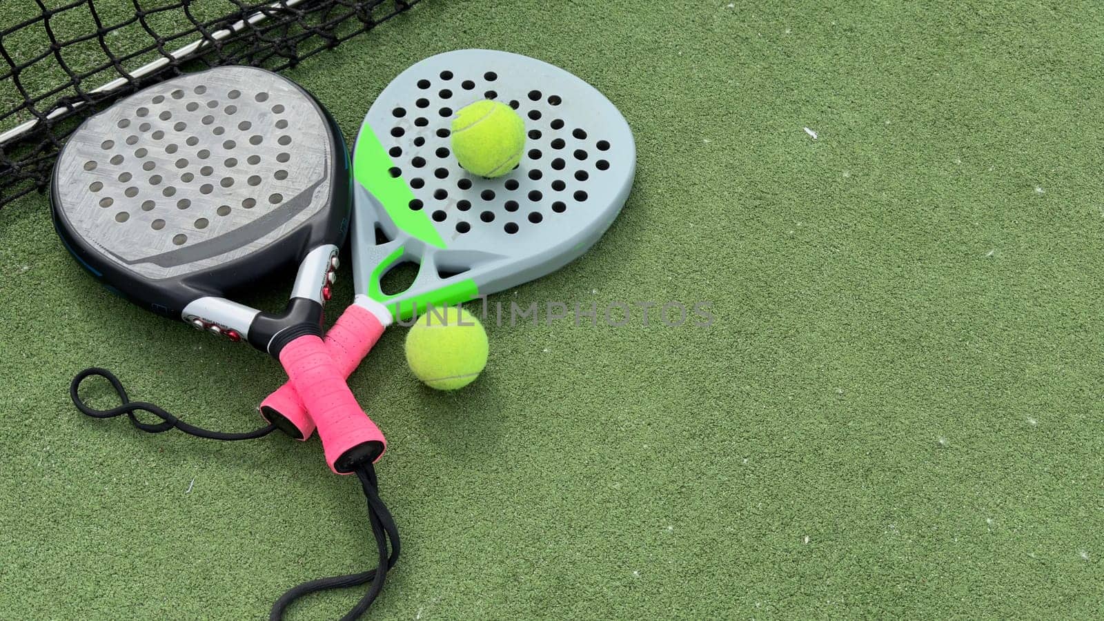 Paddle tennis objects on grass court. High quality photo