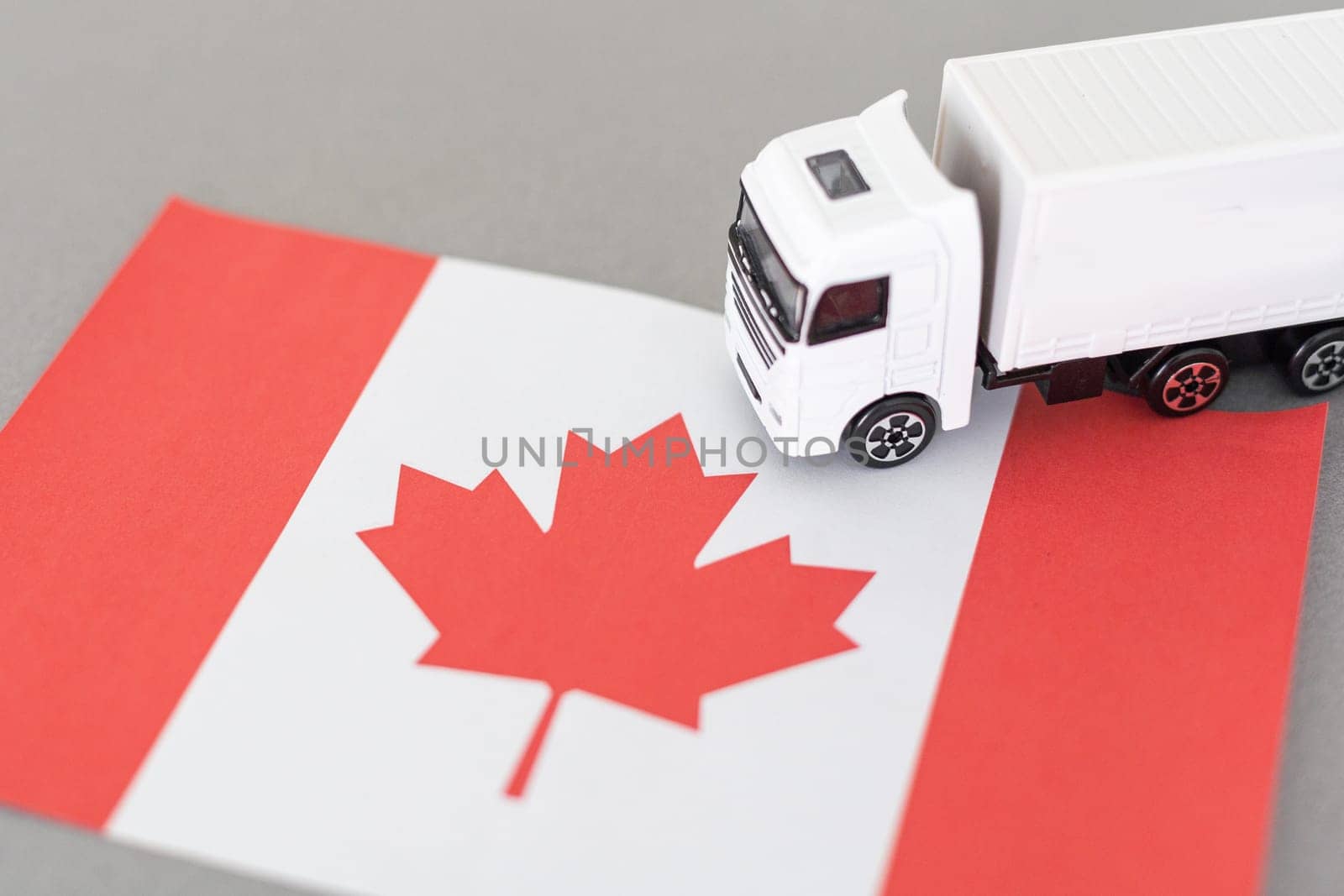 Symbol of National Delivery Truck with Flag of Canada. National Trucking Icon and Canadian flag by Andelov13
