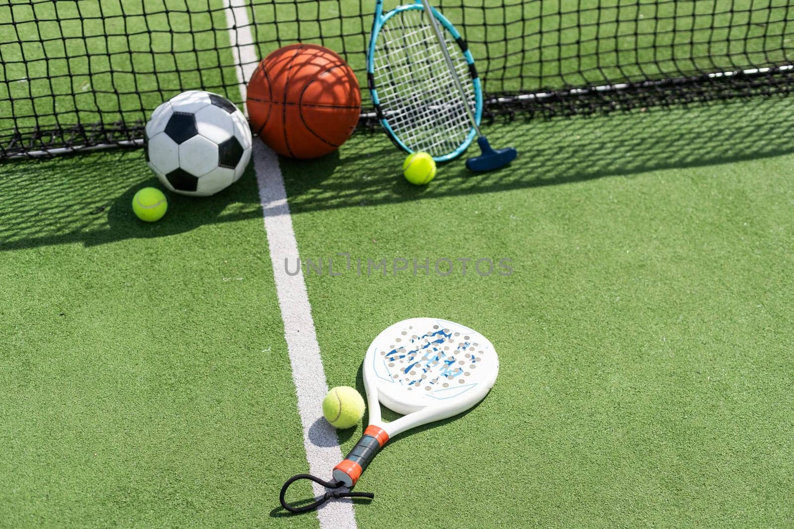 Sport games background - basketball, soccer ball, rackets, sneakers - copy space. High quality photo