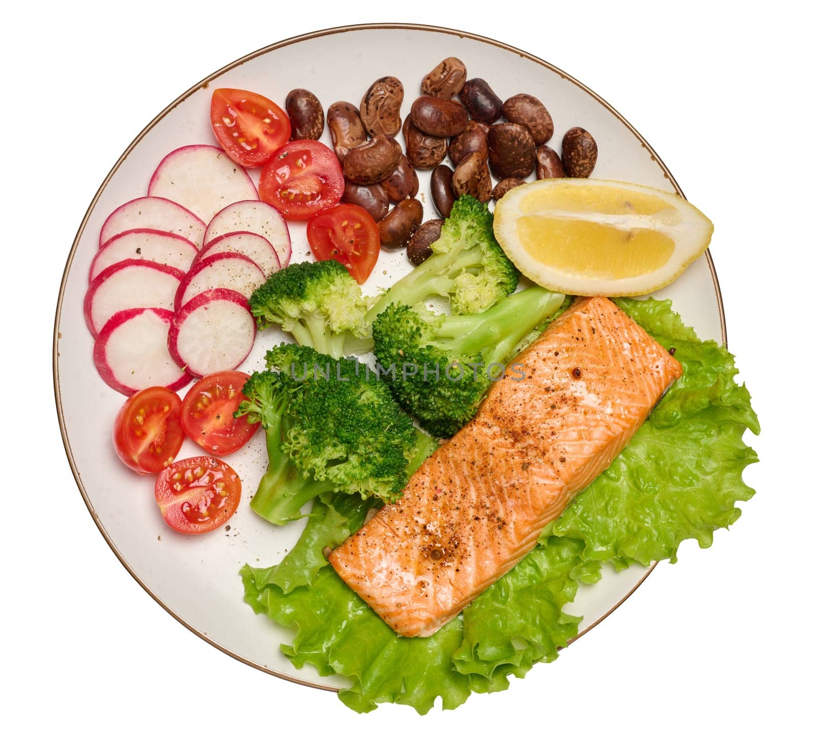 Healthy lunch with grilled trout on green lettuce, next to vegetables, tomatoes, radishes, broccoli and a portion of beans, isolated background
