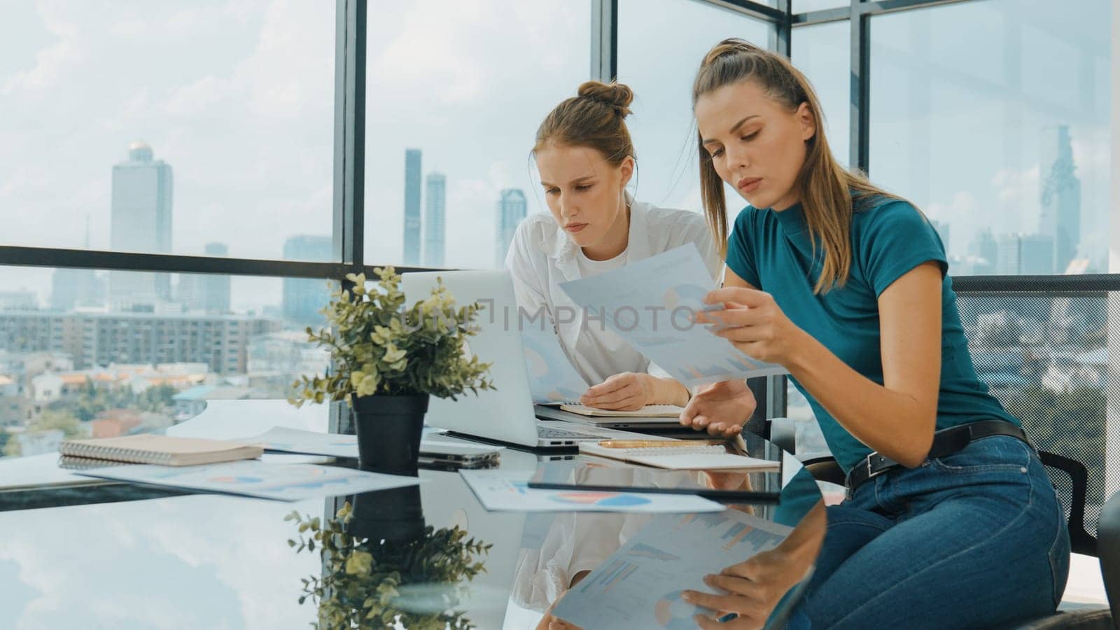 Skilled businesswoman look stress while discuss about financial strategy. Smart business team brainstorming, talking consulting sales plan, idea by using statistic document with tension. Tracery