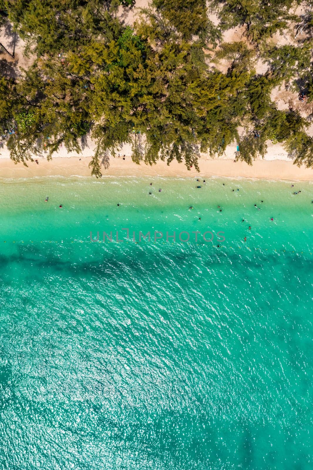 Mauritius beach aerial view of Mont Choisy beach in Grand Baie, Pereybere North. Mont Choisy, public beach in Mauritius island, Africa. Beautiful beach of Mont Choisy in Mauritius, drone aerial view.