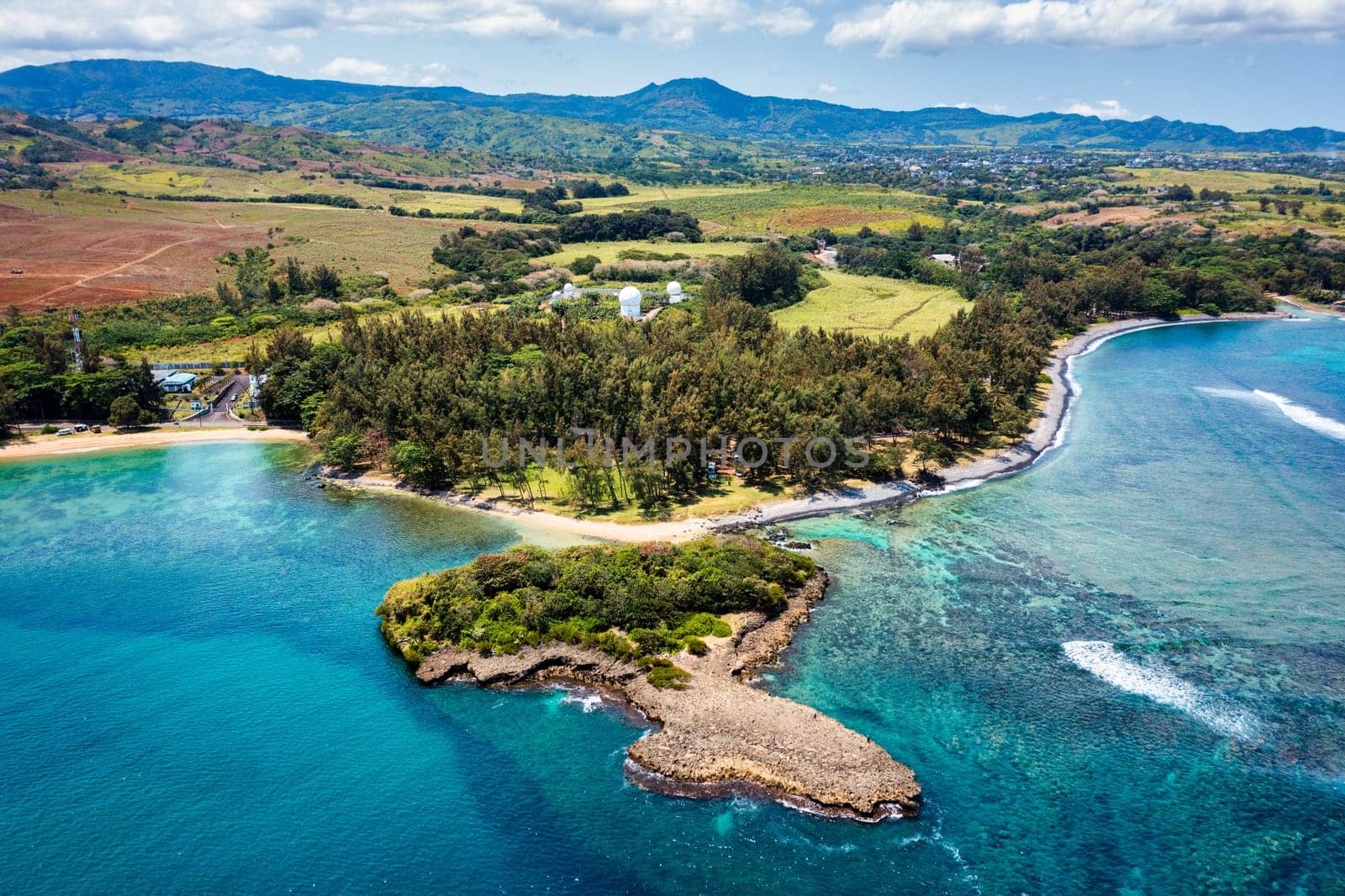 Aerial panoramic of waves of Indian Ocean and turquoise coral reef, Poste Lafayette, East coast, Mauritius. Turquoise coral reef meeting the waves of the Indian Ocean, Poste Lafayette, Mauritius.