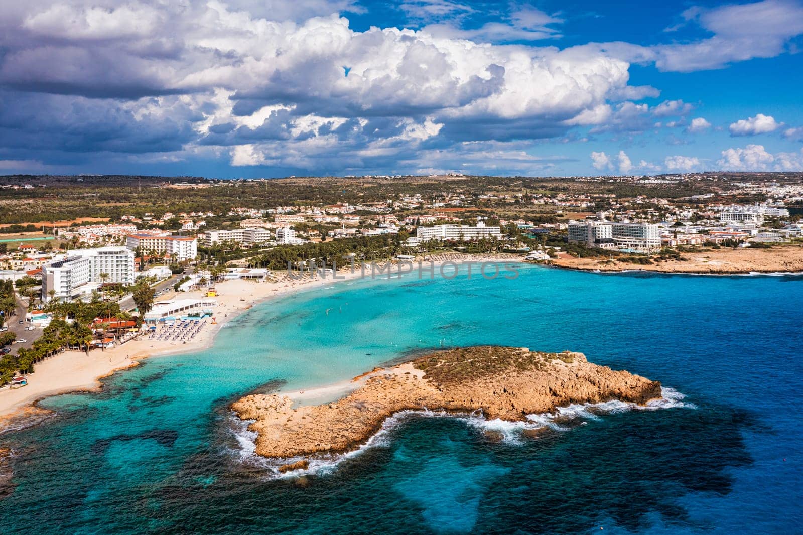 Aerial view of beautiful Nissi beach in Ayia Napa, Cyprus. Nissi beach in Ayia Napa famous tourist beach in Cyprus. A view of a azzure water and Nissi beach in Aiya Napa, Cyprus.