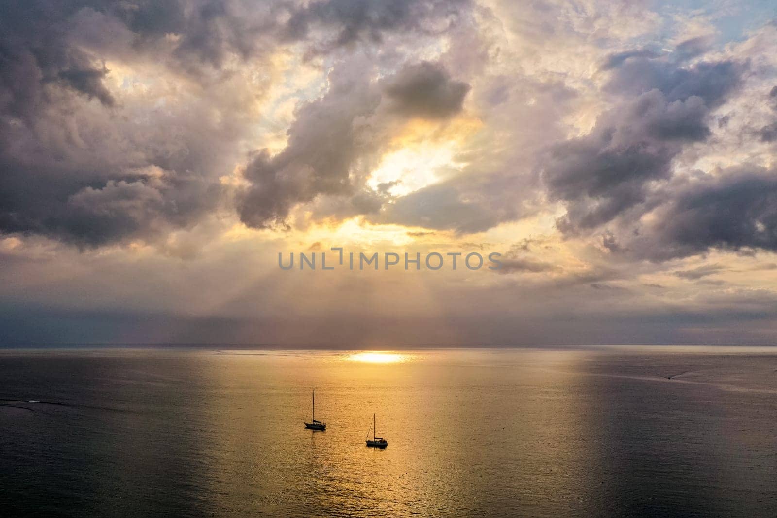 Drone flying over sea in a beautiful sunset in Indian Ocean, Mauritius. Aerial drone shoot. Sunrise over the sea. Colorful sunset on the Indian Ocean, Mauritius.