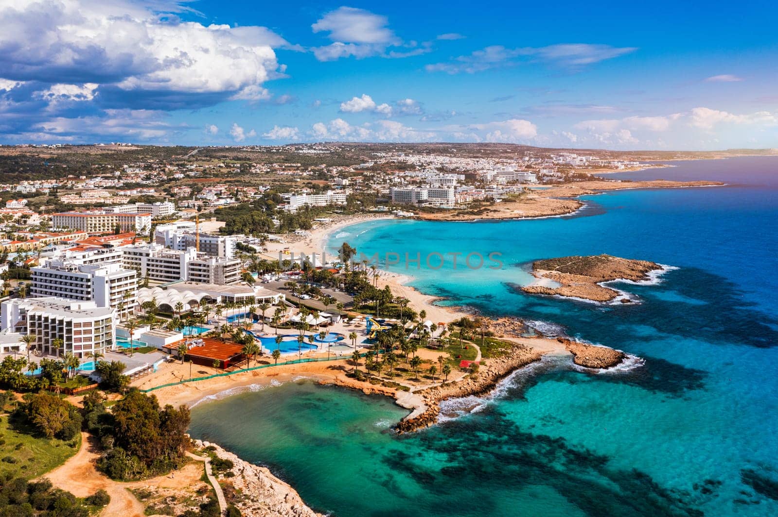 Aerial view of beautiful Nissi beach in Ayia Napa, Cyprus. Nissi beach in Ayia Napa famous tourist beach in Cyprus. A view of a azzure water and Nissi beach in Aiya Napa, Cyprus.