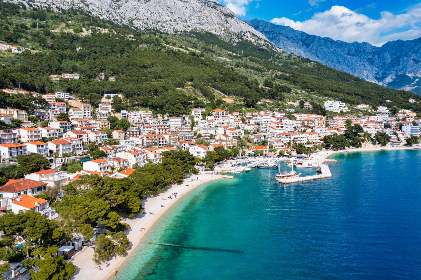 Beautiful Brela on Makarska riviera, Croatia. Adriatic Sea with amazing turquoise clean water and white sand. Aerial view of Brela town and waterfront on Makarska riviera, Dalmatia region of Croatia.