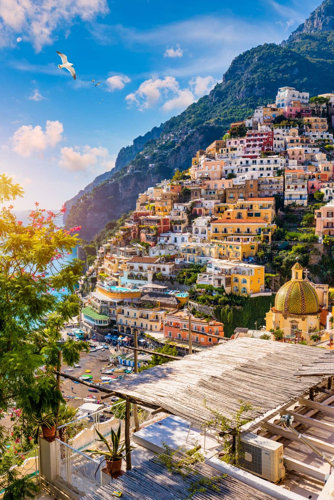 View of Positano with comfortable beach and blue sea on Amalfi Coast in Campania, Italy. Positano village on the Amalfi Coast, Salerno, Campania. Beautiful Positano, Amalfi Coast in Campania.