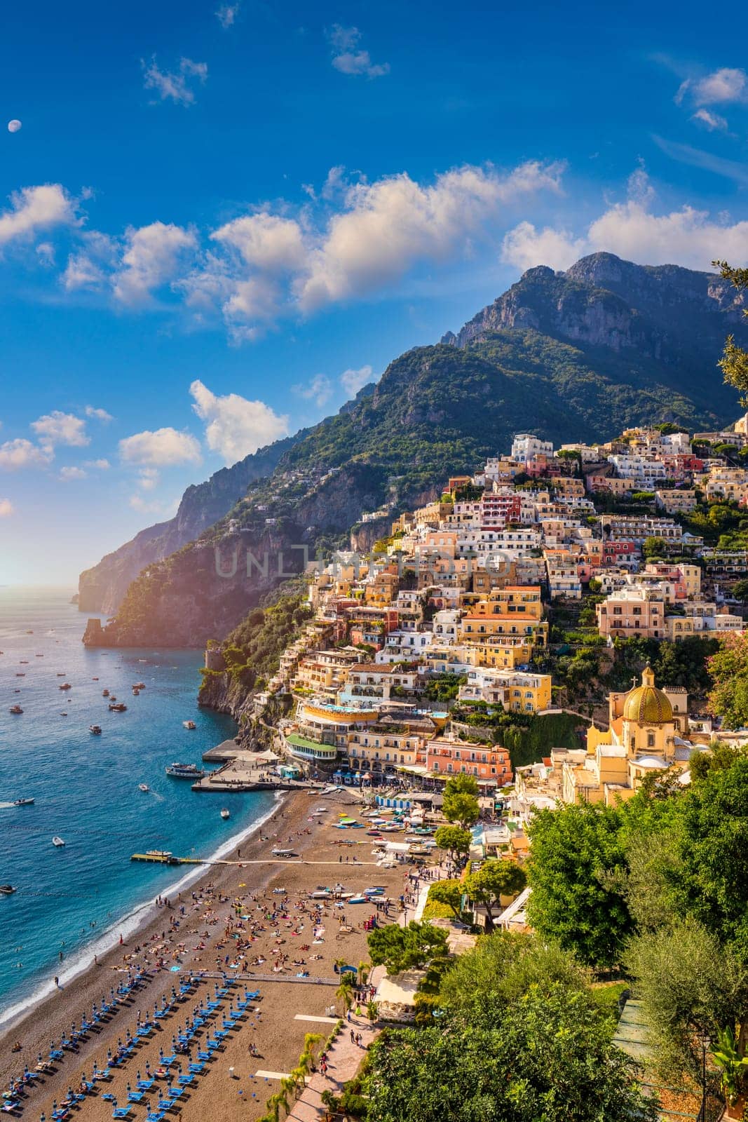 View of Positano with comfortable beach and blue sea on Amalfi Coast in Campania, Italy. Positano village on the Amalfi Coast, Salerno, Campania. Beautiful Positano, Amalfi Coast in Campania. by DaLiu
