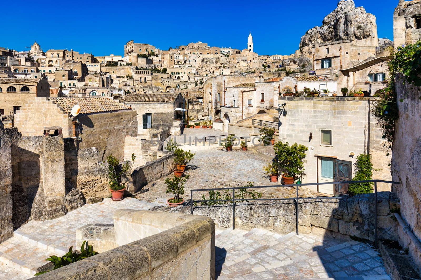 Panoramic view of the ancient town of Matera (Sassi di Matera) in a beautiful autumn day, Basilicata, southern Italy. Stunning view of the village of Matera. Matera is a city on a rocky outcrop.