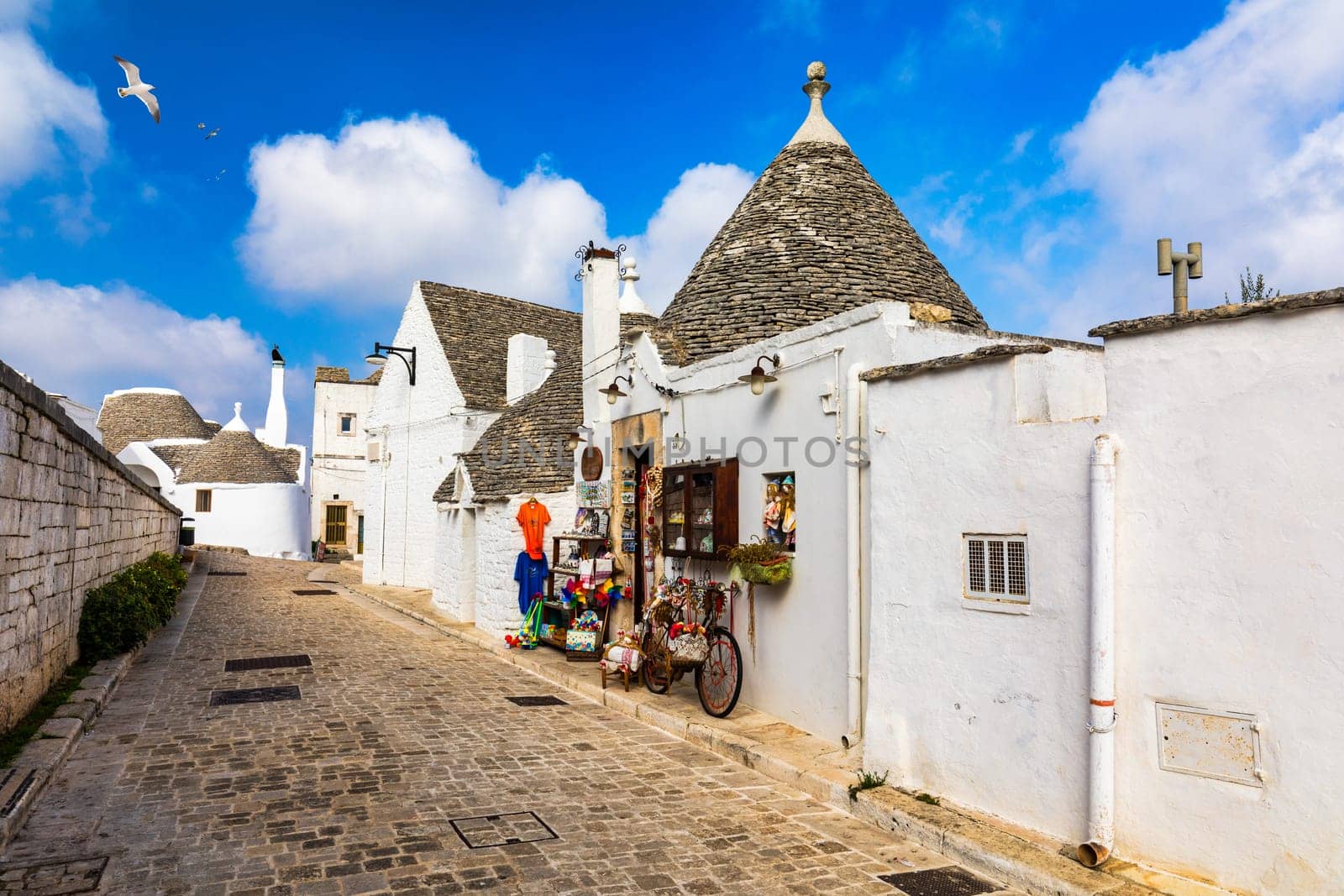 The traditional Trulli houses in Alberobello city, Apulia, Italy. Cityscape over the traditional roofs of the Trulli, original and old houses of this region, Apulia, Alberobello, Puglia, Italy. 