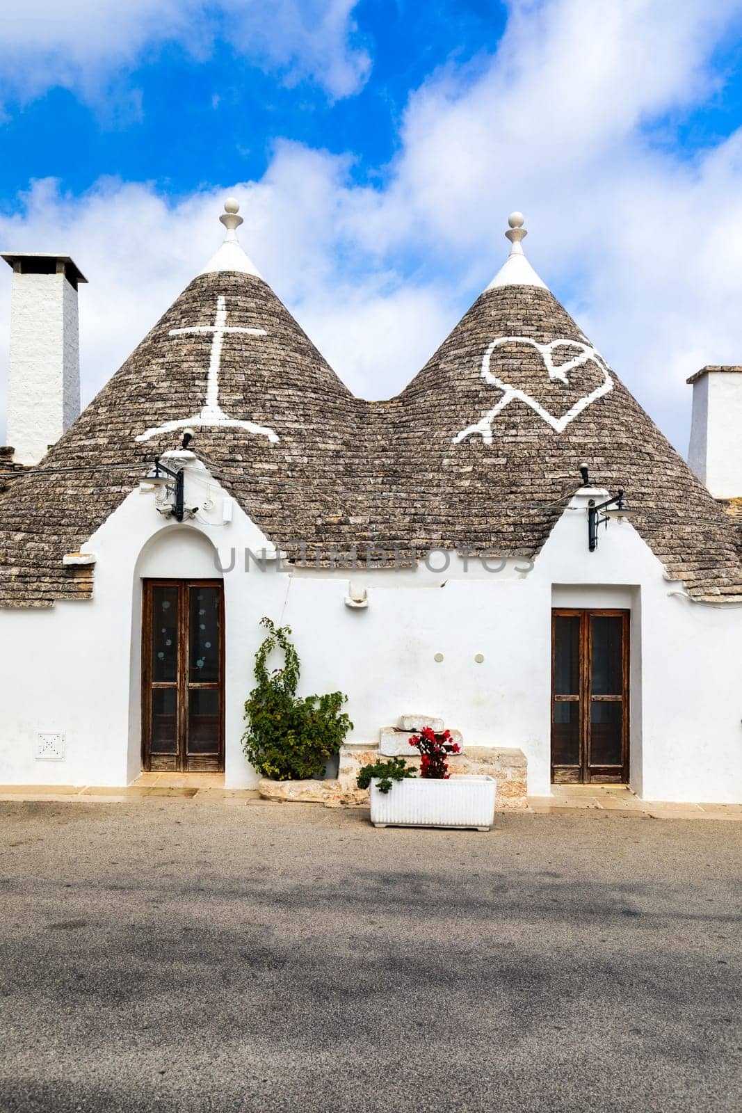 The traditional Trulli houses in Alberobello city, Apulia, Italy. Cityscape over the traditional roofs of the Trulli, original and old houses of this region, Apulia, Alberobello, Puglia, Italy. 